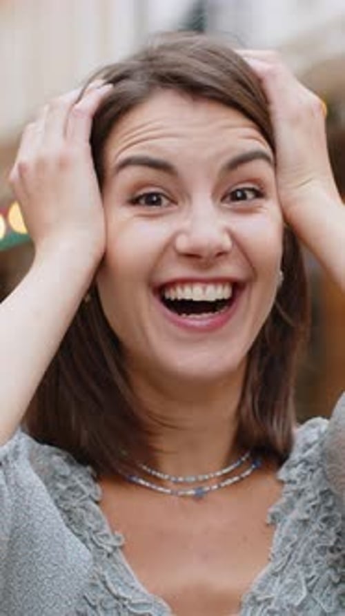 Young Woman Looking Surprised at Camera Shocked By Sudden Win Good Victory News Wow in City Street