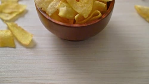 Plantain Chips in a Wooden Bowl Close Up