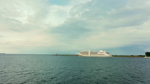 Aerial View of a Cruise Ship Sailing on the Ocean or Sea on a Cloudy Summer Day