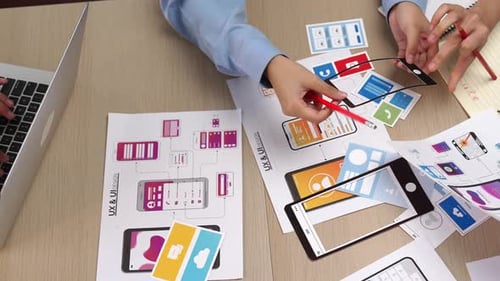 UX and UI designers working on app interface