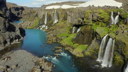 Aerial view of waterfall in canyon, Iceland.