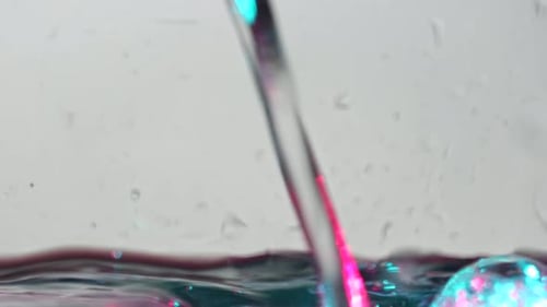 Neon Water Stream Splash with Bubbles