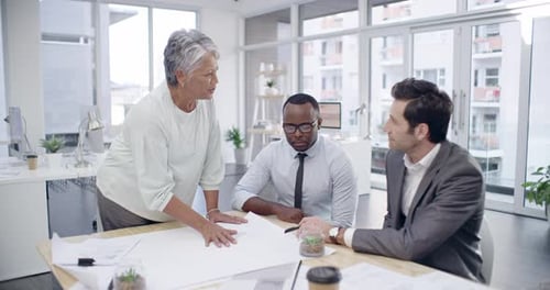 Architects Teamwork on Blueprint in Modern Office