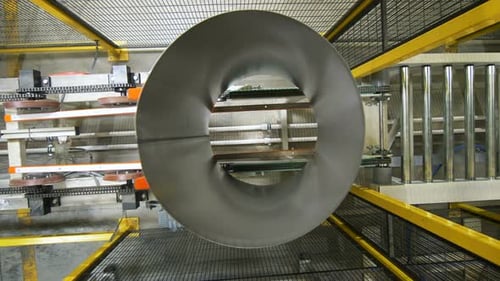 Upper View Large Grey Tubes Transported By Conveyor