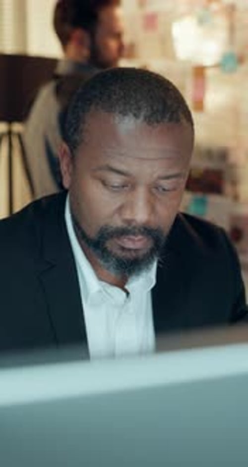 Detective, mature man and computer in office to search lead, problem solving or check surveillance