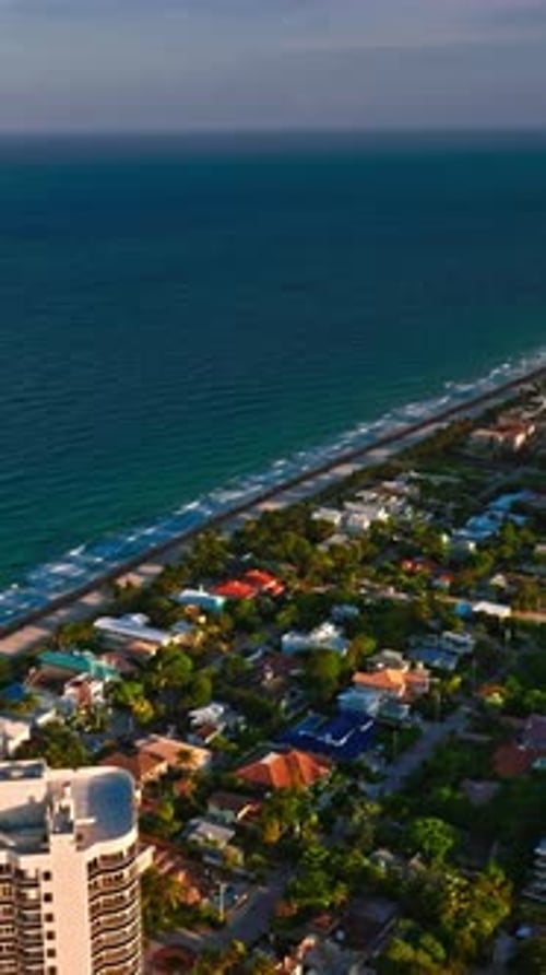 Aerial view of Miami coastline and residential areas in vertical format