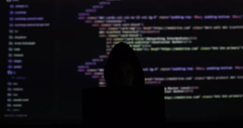 No Face Hacker with Laptop with Abstract Programming Code in the Background Man Hacker Working on