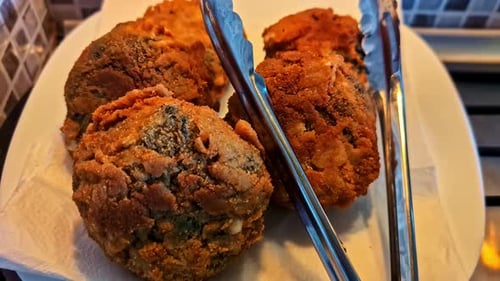 Crispy Fried Food with Tongs Close Up