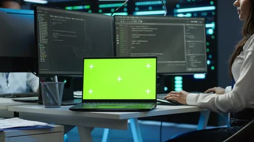 Woman Doing Maintenance on Server Room Infrastructure Using Mockup Laptop