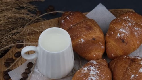 Fresh Croissants and Milk on Wooden Tray