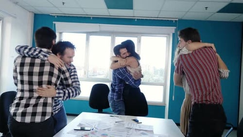 Cheerful Colleagues Celebrate Achieving Company Goals