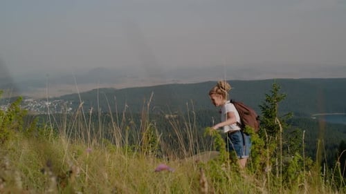 Woman Hiking up Green Mountain with Backpack