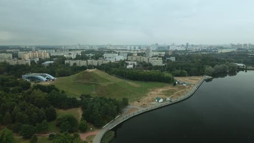 Lake In The City Park. Ski Center Hill. Urban Landscape. Sleeping Area Of A Big City.