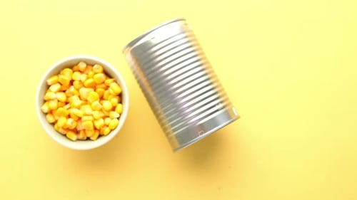 Canned Corn and Bowl of Corn Kernels