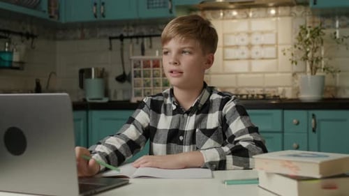 Boy Studying Online at Home During Daytime