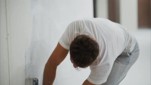 Man Applying Plaster to Interior Wall