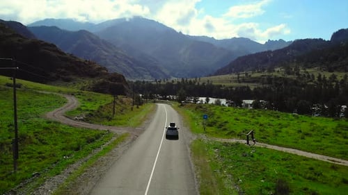 Aerial View of Car Driving on Mountain Road Media