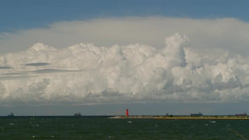 Timelapse Movement of Cumulus Rain Clouds Over the Sea with Ships