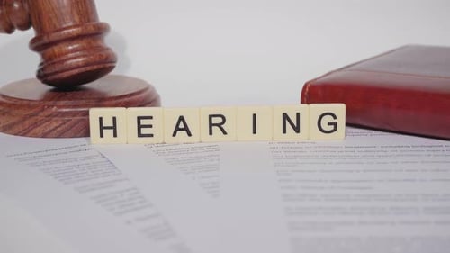 Hearing Gavel and Law Documents Close Up