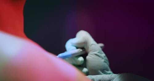 Milan/Italy-01.02.2019:Slow motion of professional master of the art of tattooing doing a tattoo t