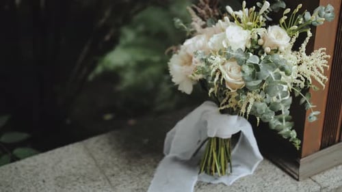Bouquet of Beautiful Stylish Pastel Flowers Stands on Square Tiled Floor Near Column Flower
