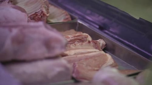 Pork cuts on display in a supermarket refrigerator. Healthy food. Meat industry. Argentina.