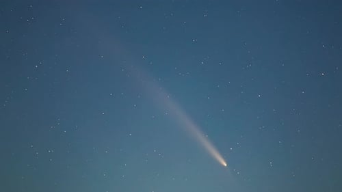 Bright Comet Shines in the Starry Night Sky