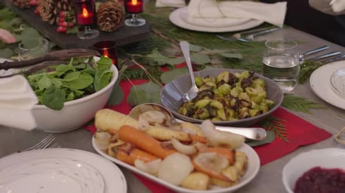 Family at Holiday Dinner Table with Food and Decor