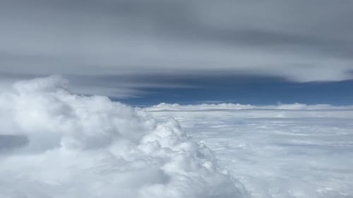 Scenic Aerial View of White Puffy Clouds and Sky