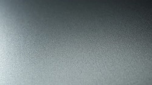 Close-up reveals a detailed view of a metal texture.