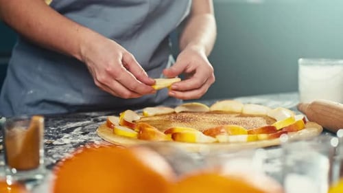 Woman Preparing Fruit Pie in Kitchen at Home