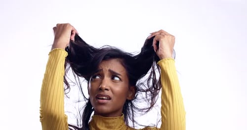 Face, messy hair and woman with stress, frustrated or treatment fail isolated on a white studio
