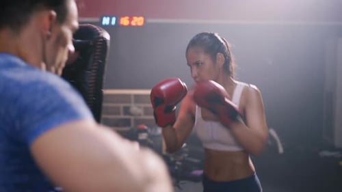 Sporty Coach Training Athlete woman Boxing exercise