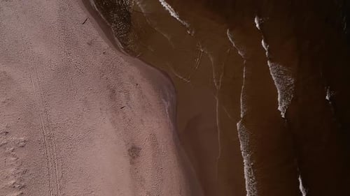Drone Aerial View of Waves Sea Ocean Coast Beach and Dunes Dark Calm Sea Waves Nature Landscape