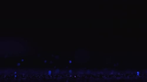 Abstract Glitter Background with Falling Blue Particles