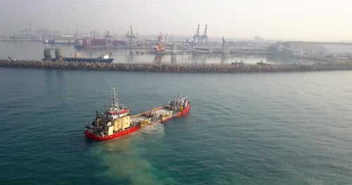 Industrial Boat Sailing into Port Aerial Footage