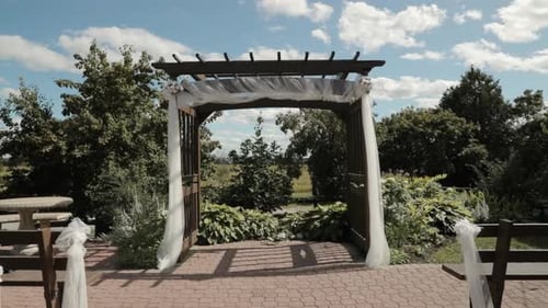 Wedding Arch and Chairs at Outdoor Venue