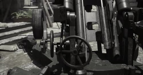 Detailed View of an Artillery Piece in a Historic Military Setting