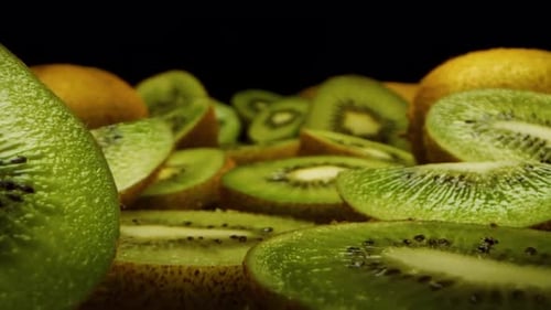 fresh sliced kiwi, smoothly gliding close up shot