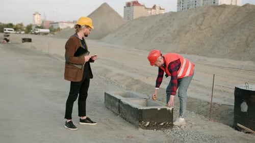 Director Work with Supervisor at Construction Site