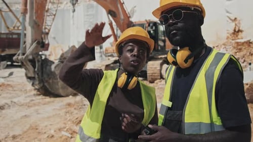 Forewoman Giving Instructions To Worker