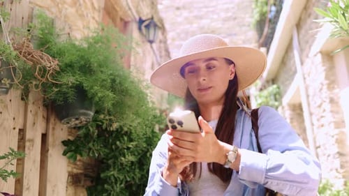 Portrait View of Young Attractive Caucasian Woman Taking Pictures of Beautiful Places During