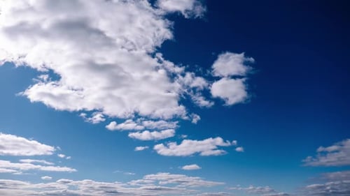 Timelapse of Cumulus Clouds Moves In The Blue Sky