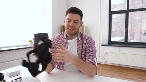 Enthusiastic man presenting a virtual reality headset