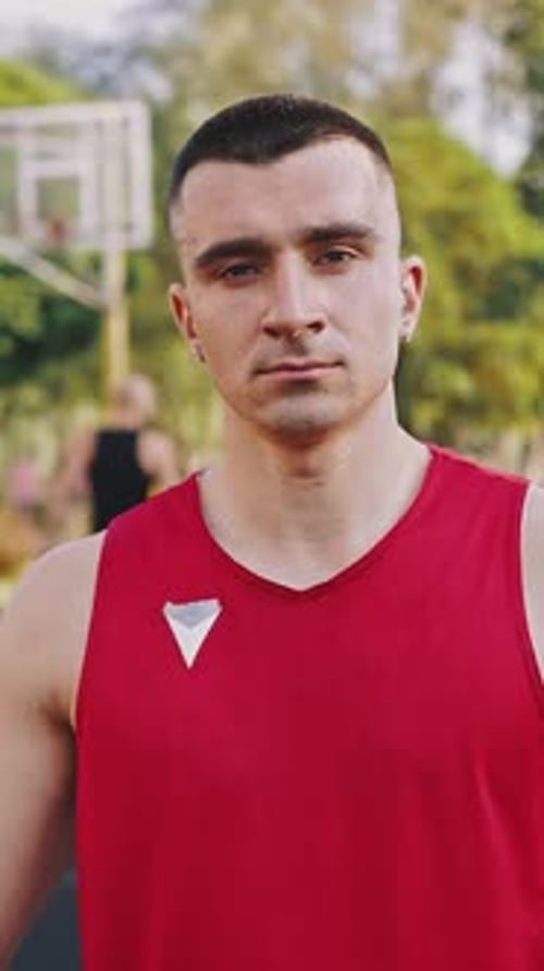 Man Wearing Red Jersey on Basketball Court