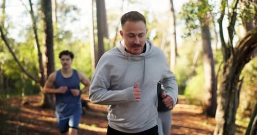 Man, friends and trail running in forest for fitness, challenge and training with smile in summer
