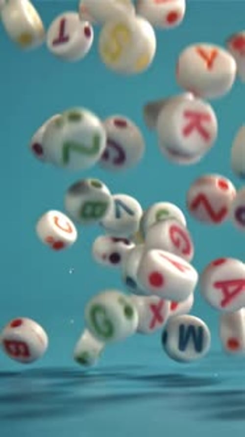 Falling Letters on a Blue Background Filmed on a Highspeed Camera at 1000 Fps