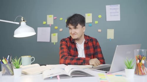 Crying male student unhappy.