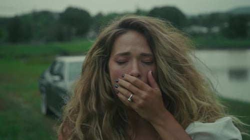 An Emotional Scene By the Water A Heartfelt Moment of Distress and Vulnerability