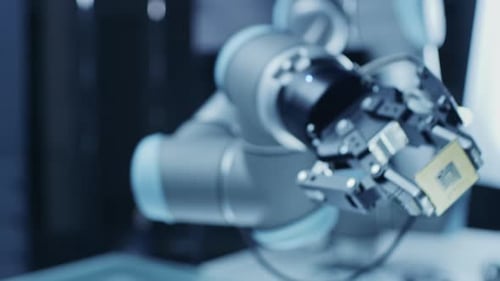 Robot Arm Holding Computer Chip in Lab